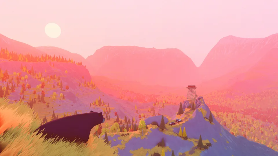 A black bear overlooking a sunset valley with a fire lookout in over the hill